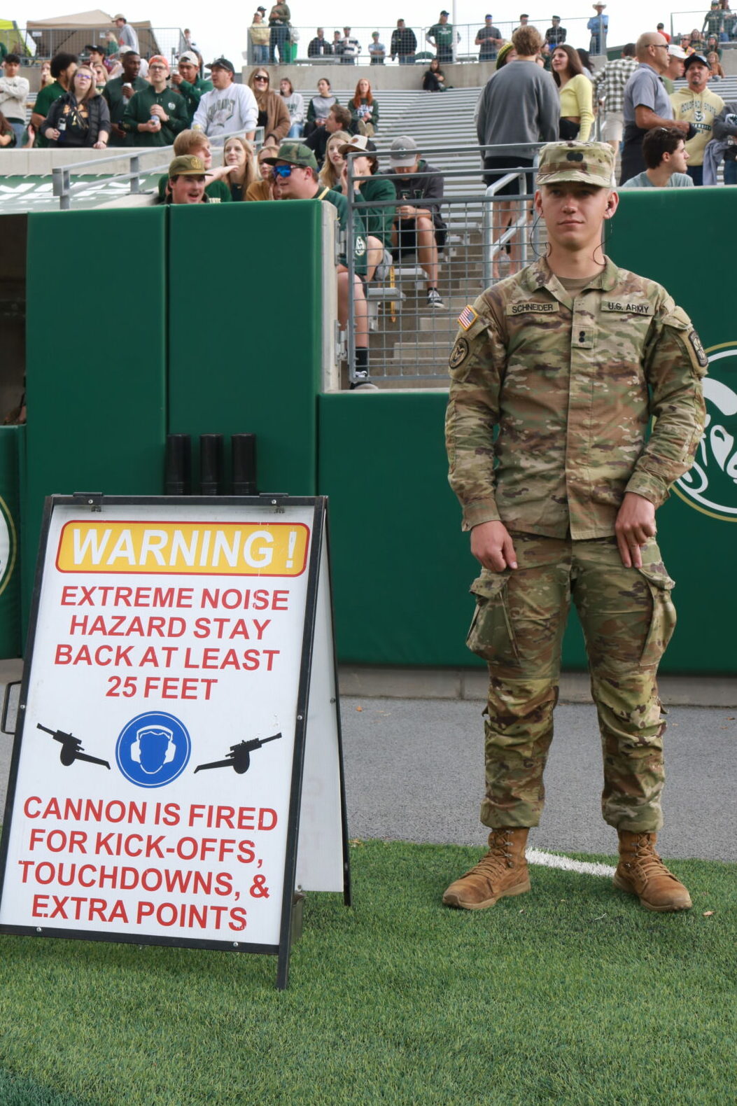 An ROTC Cadet stands near "Danger Area Echo," ensuring no spectators stand in the line of fire. 