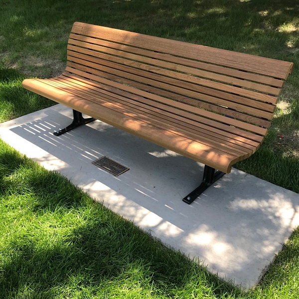 Commemorative bench at CSU with plaque on bottom