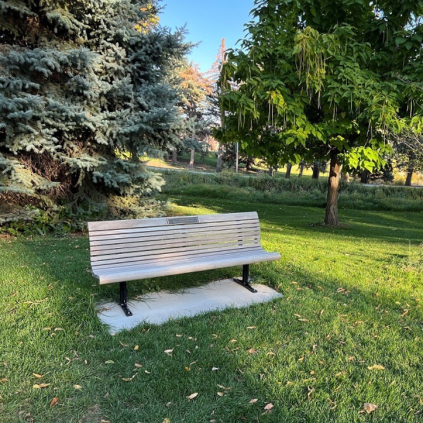 Commemorative bench at CSU with plaque on bench