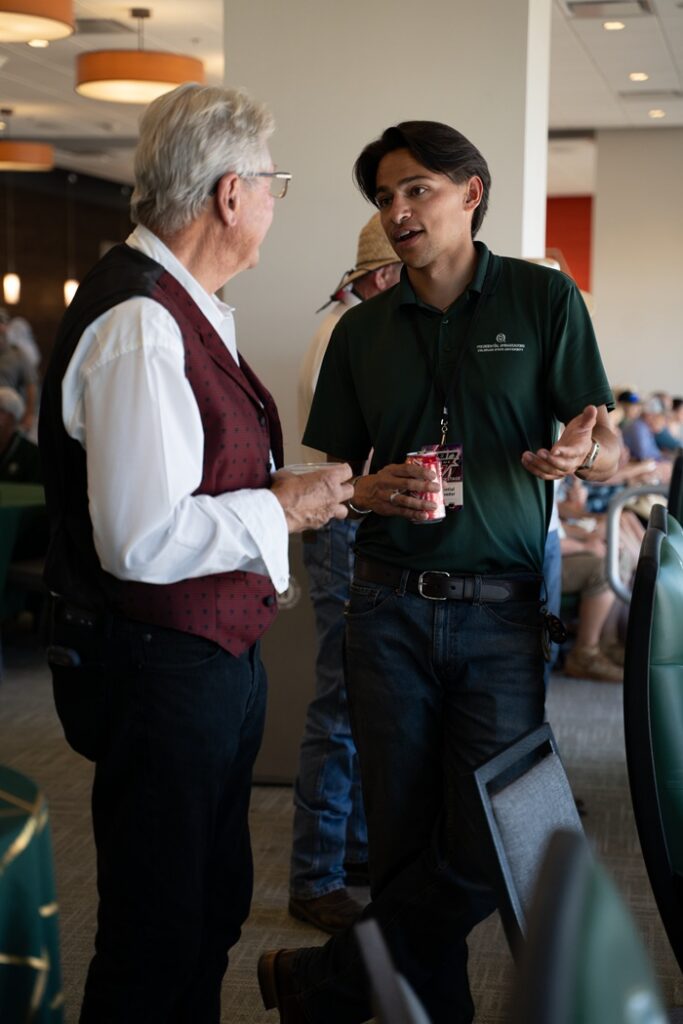 A Presidential Ambassador chats with an event participant at the 1870 Exclusive