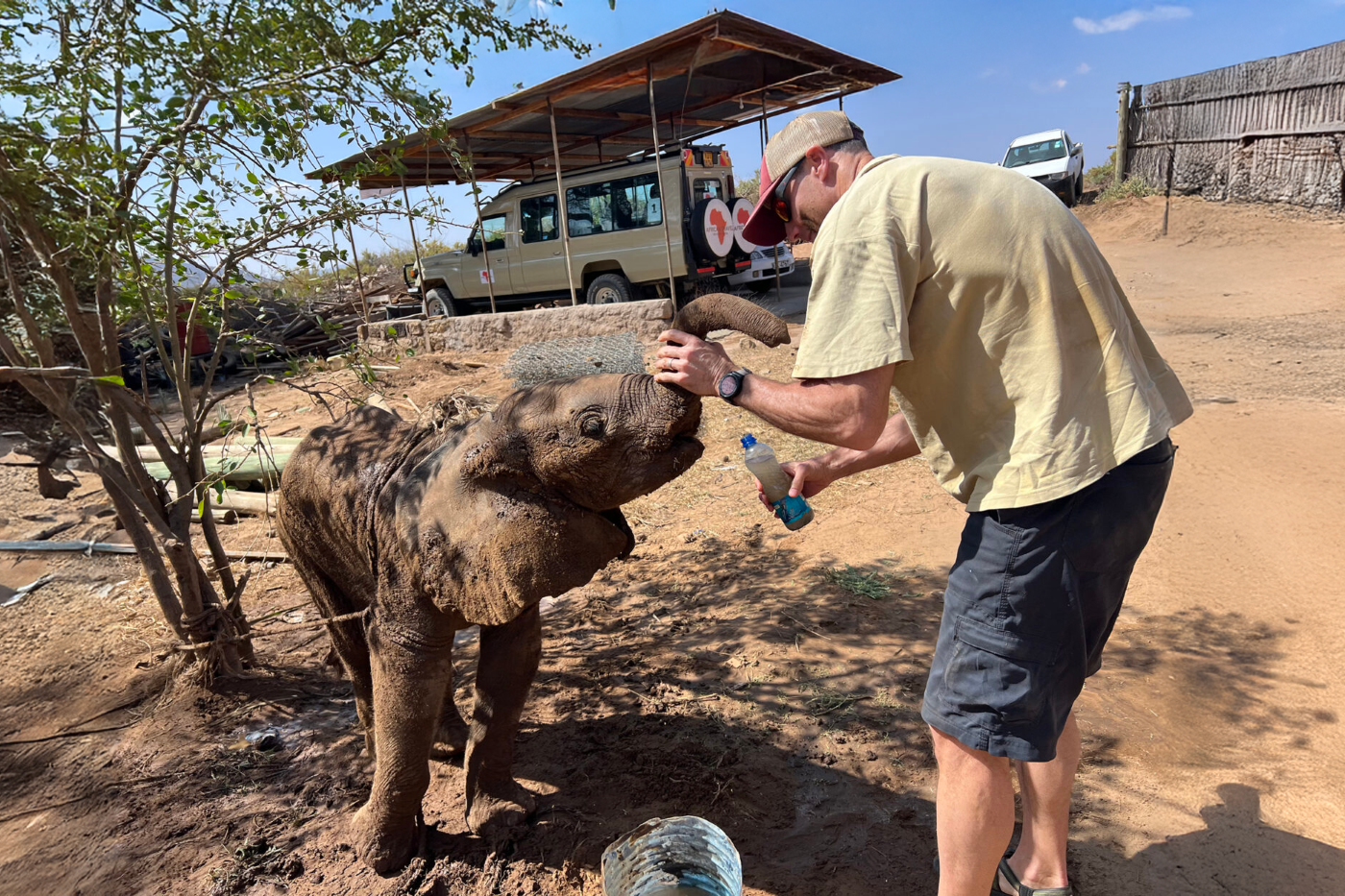 George Wittemyer with baby elephant